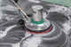 Thai people cleaning black granite floor with machine and chemic Wall Mural