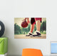 Young man on basketball court dribbling with bal Wall Mural