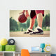 Young man on basketball court dribbling with bal Wall Mural