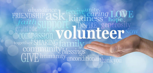 Volunteers needed hand gesture on blue bokeh Wall Mural