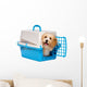 Cute happy havanese puppy dog is looking out from a pet crate Wall Decal