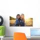 Two cheerful friends snuggling outdoors in the park Wall Mural