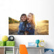 Two cheerful friends snuggling outdoors in the park Wall Mural