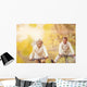Active seniors ridding bike and having fun Wall Mural