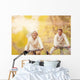 Active seniors ridding bike and having fun Wall Mural