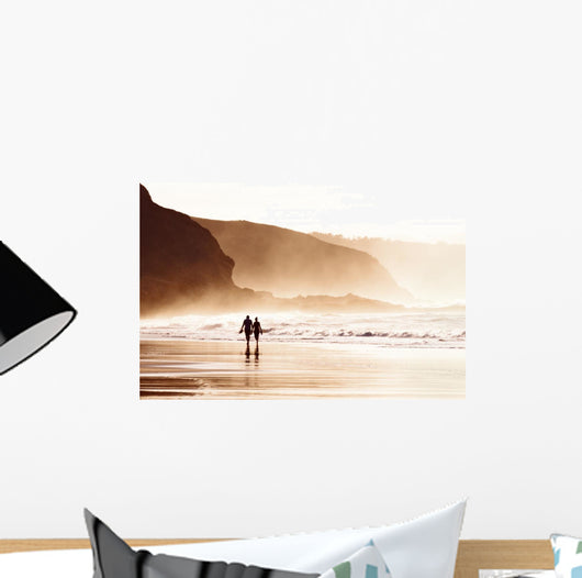 couple walking on beach with fog Wall Mural