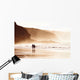 couple walking on beach with fog Wall Mural