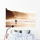 couple walking on beach with fog Wall Mural