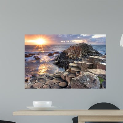 Sunset Giant S Causeway Wall Mural shown on a wall