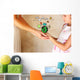 photo of mother and child holding hands and showing a better wor Wall Mural