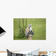 Lemur sitting on a log funny staring fixed gaze big eyes Wall Mural