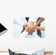 International business team showing unity with their hands toget Wall Mural