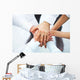 International business team showing unity with their hands toget Wall Mural