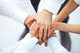 International business team showing unity with their hands toget Wall Mural