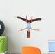 Young woman making aerial yoga exercises in stretching Wall Decal