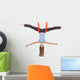 Young woman making aerial yoga exercises in stretching Wall Decal