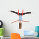 Young woman making aerial yoga exercises in stretching Wall Decal