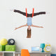 Young woman making aerial yoga exercises in stretching Wall Decal