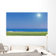 Beautiful summer view of a golf course. background of the sea. Wall Mural