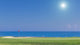 Beautiful summer view of a golf course. background of the sea. Wall Mural