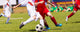 Football match for children. Boys playing football tournament Wall Mural