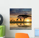 Giraffes with Kudu at sunset Wall Mural