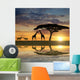 Giraffes with Kudu at sunset Wall Mural
