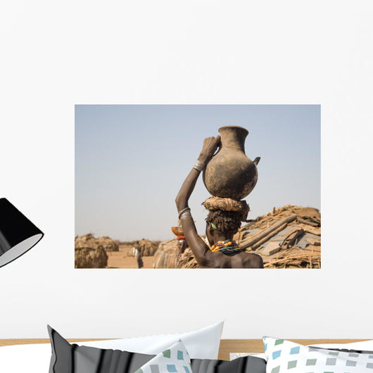 Woman carries on her head a container with water, Ethiopia Wall Mural