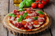 pizza with mozzarella and prosciutto, tomatoes Wall Mural