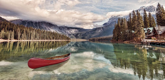 Red canoe on Emerald Lake Wall Mural