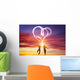 Happy couple in love jump making heart symbol of light Wall Mural