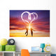 Happy couple in love jump making heart symbol of light Wall Mural