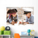 Boys play in the sea battle Wall Mural