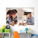 Boys play in the sea battle Wall Mural