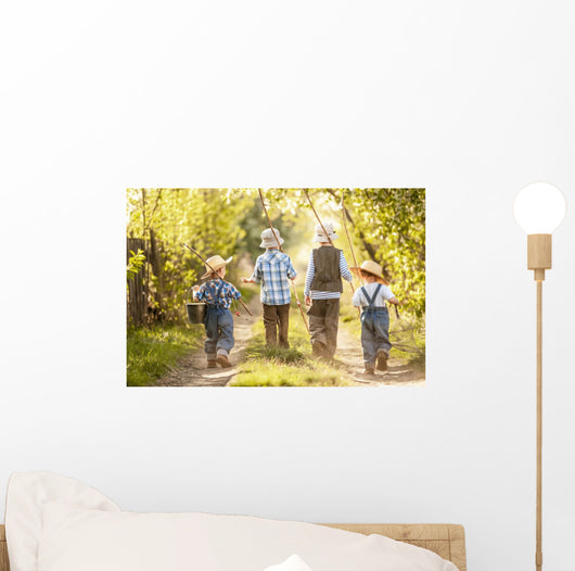 Boys go fishing with fishing rods on a rural street Wall Mural
