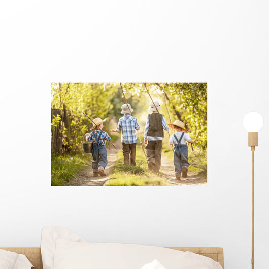 Boys go fishing with fishing rods on a rural street Wall Mural