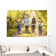 Boys go fishing with fishing rods on a rural street Wall Mural