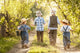 Boys go fishing with fishing rods on a rural street Wall Mural