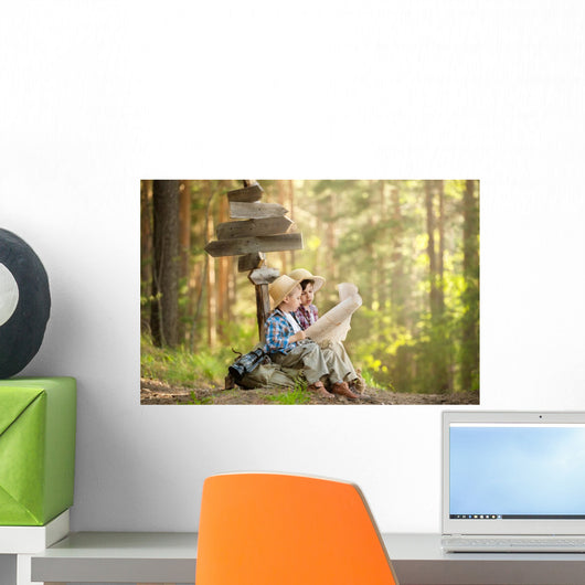 Boys on a forest road with backpacks Wall Mural