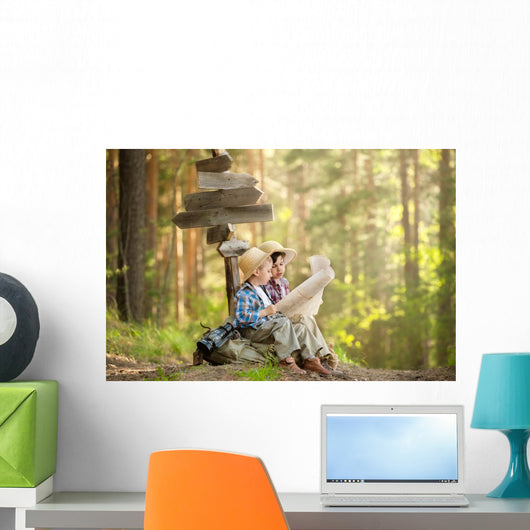 Boys on a forest road with backpacks Wall Mural