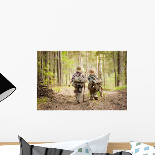 Boys on a forest road with backpacks Wall Mural