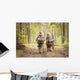 Boys on a forest road with backpacks Wall Mural