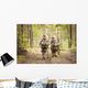 Boys on a forest road with backpacks Wall Mural