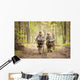Boys on a forest road with backpacks Wall Mural