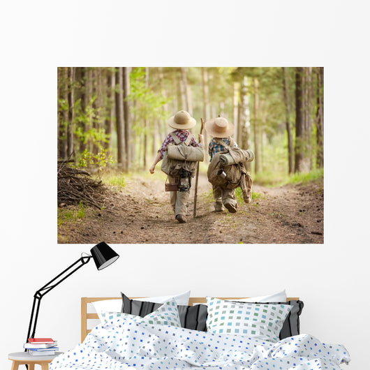 Boys on a forest road with backpacks Wall Mural