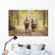 Boys on a forest road with backpacks Wall Mural