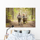 Boys on a forest road with backpacks Wall Mural