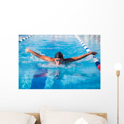 Butterfly Swimmer Wall Mural shown on a wall