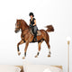 Brunette woman cantering on chestnut horse isolated on white Wall Decal