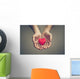 old hands of the elderly giving a red heart Wall Mural